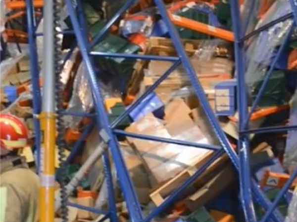 collapsed pallet racking with damaged poles
